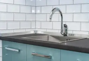 A black solid surface countertop in a home in Springville, UT.